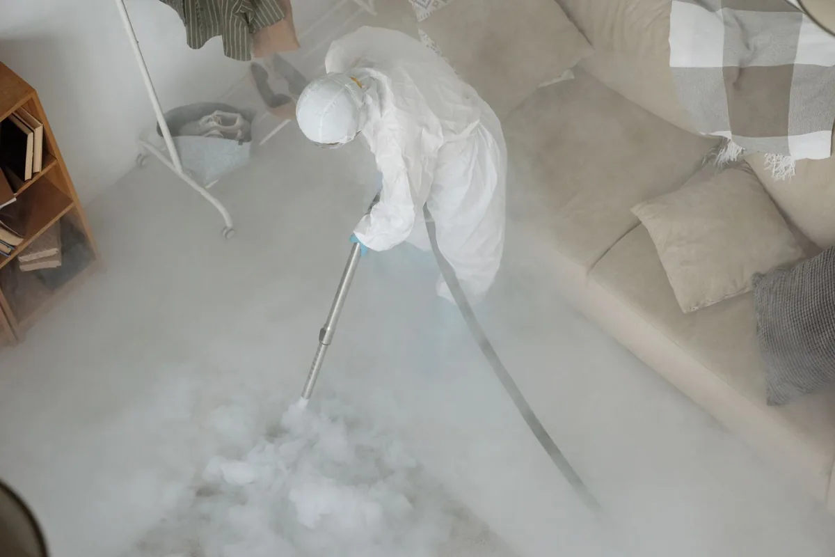 Biohazard cleanup technician in protective equipment, Cresco, IA